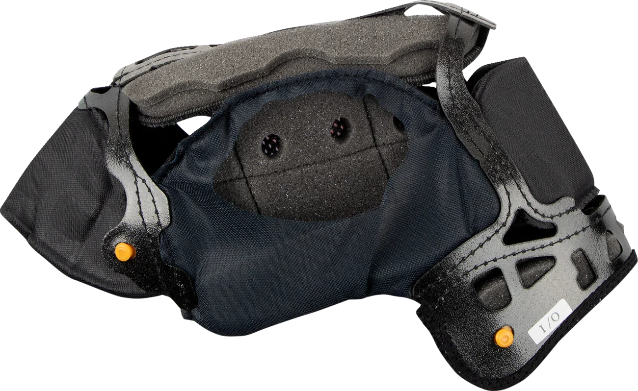 Black motorcycle helmet interior with padded lining and orange adjustment knobs for secure fit