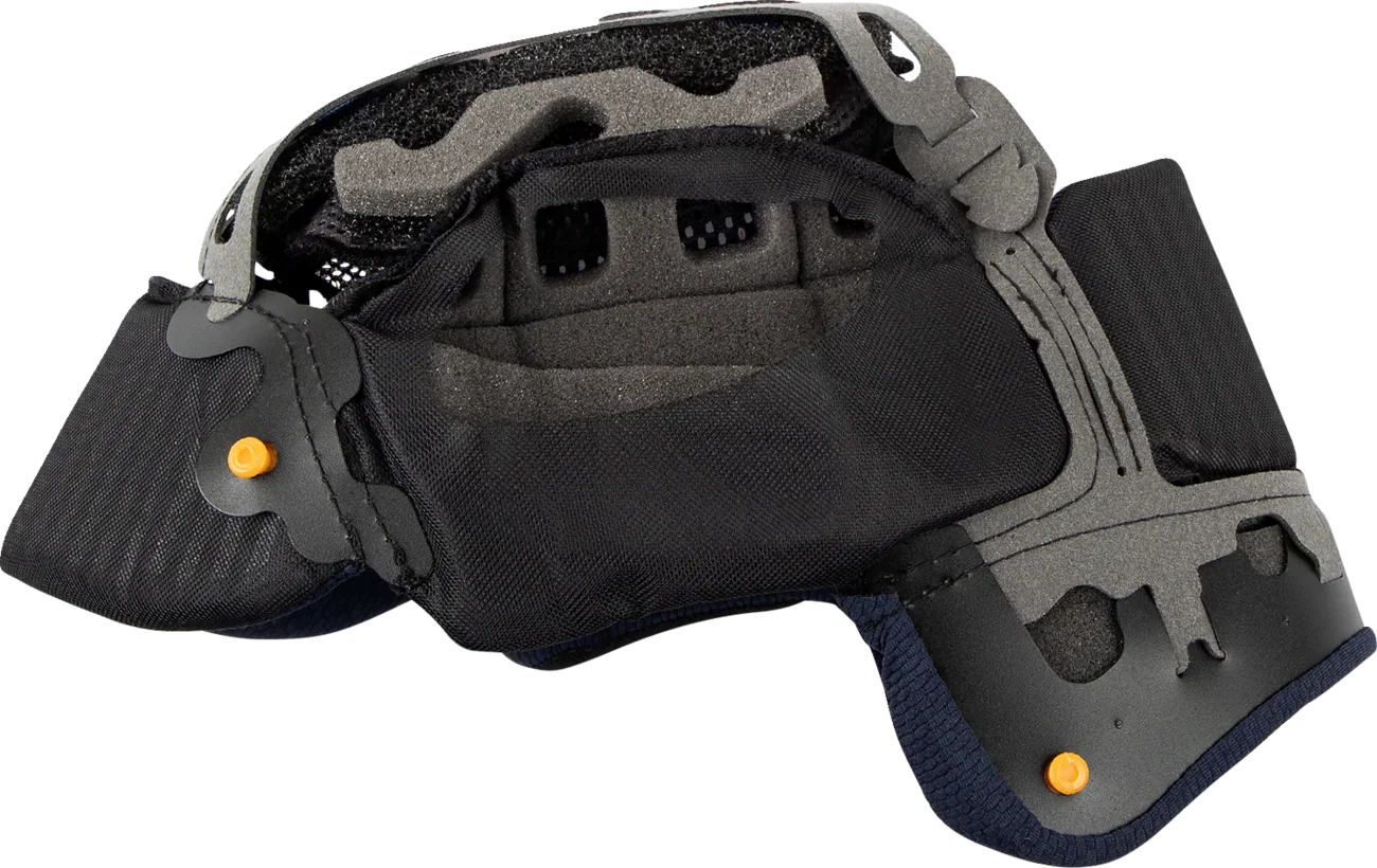 Motorcycle helmet interior with black padding, gray foam, and orange adjustment knobs for comfort and fit.