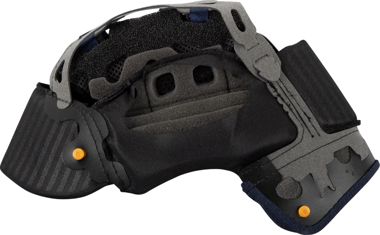 Motorcycle helmet interior with black padding, gray shell, and orange adjustment knobs for comfort and fit