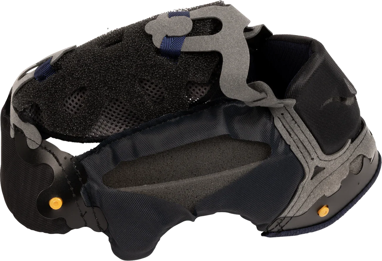 Motorcycle helmet interior with black foam padding, gray structure, and blue straps for comfort and safety