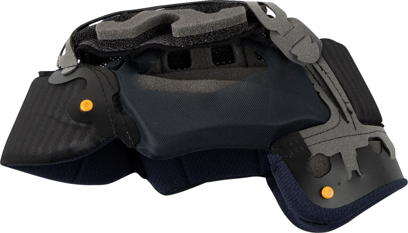 Black motorcycle helmet interior with gray foam padding and orange adjustment knobs for secure fit