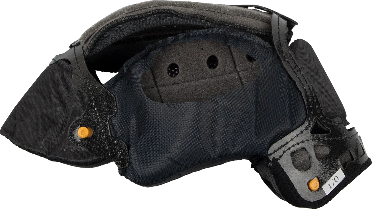 Black motorcycle helmet interior with padding, ventilation holes, and orange adjustment knobs for comfort and fit.