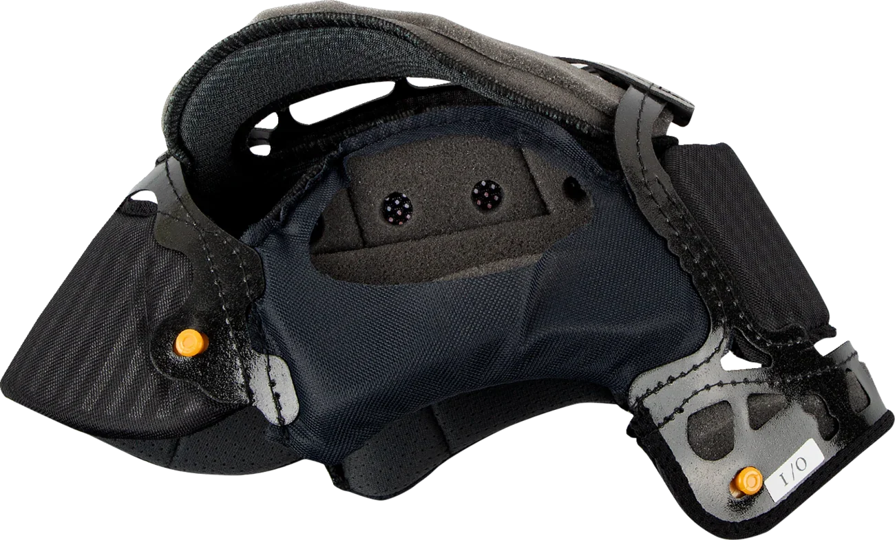 Black motorcycle helmet interior with padded lining, ventilation holes, and orange adjustment knobs for secure fit