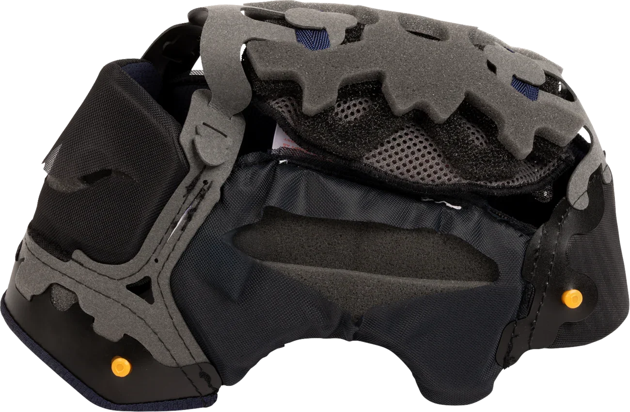 Motorcycle helmet interior with gray foam padding, black mesh lining, and orange adjustment points for comfort and fit.