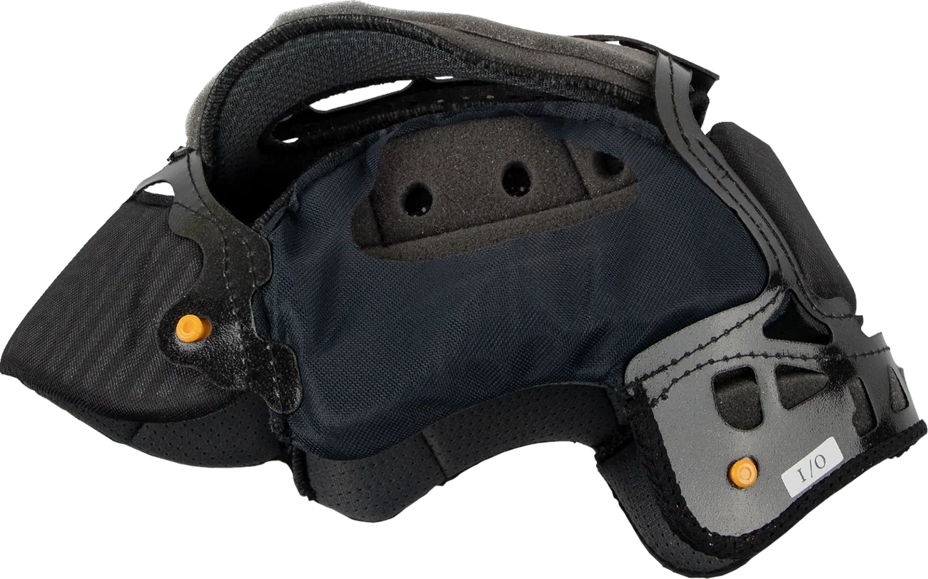 Black motorcycle helmet interior with ventilation holes and orange adjustment knobs