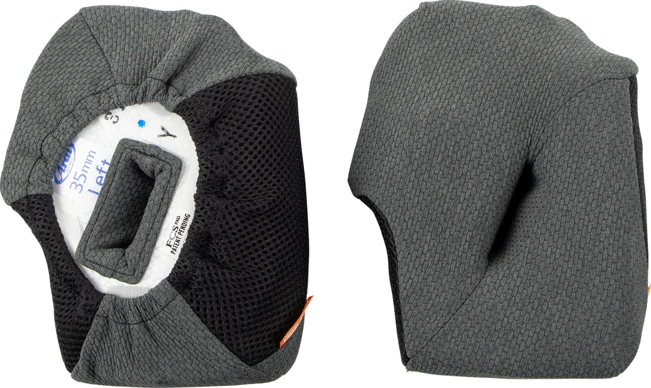 Gray and black motorcycle helmet cheek pads with 35mm foam, mesh lining, and FCS pad label for comfort and fit.