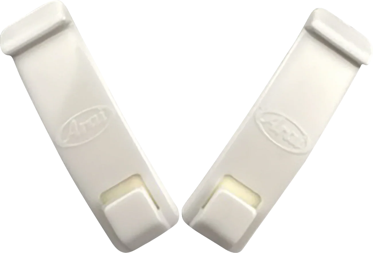 White Arai helmet visor clips for secure shield attachment