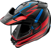 Arai off-road motorcycle helmet with red, blue, and black graphics, Honda logo, and clear visor