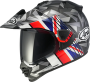 Arai Drudi Performance motorcycle helmet with geometric gray, red, blue, and white graphics and tinted visor