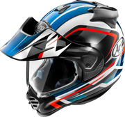 Arai motorcycle helmet with blue, white, and red graphics, clear visor, and peak for off-road riding