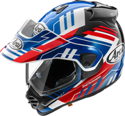 Arai Drudi Performance motorcycle helmet with blue, red, and white graphics, clear visor, and emergency release