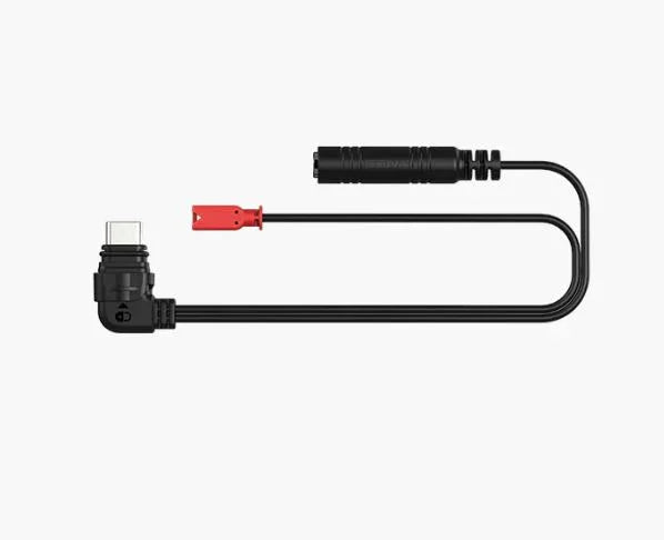 Black electrical connector with red clip on a white background